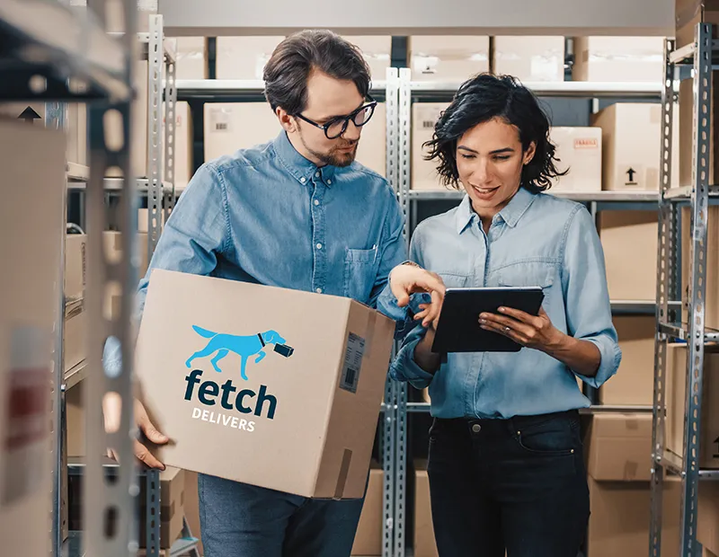 Two Alto staff reviewing a tablet in a stockroom